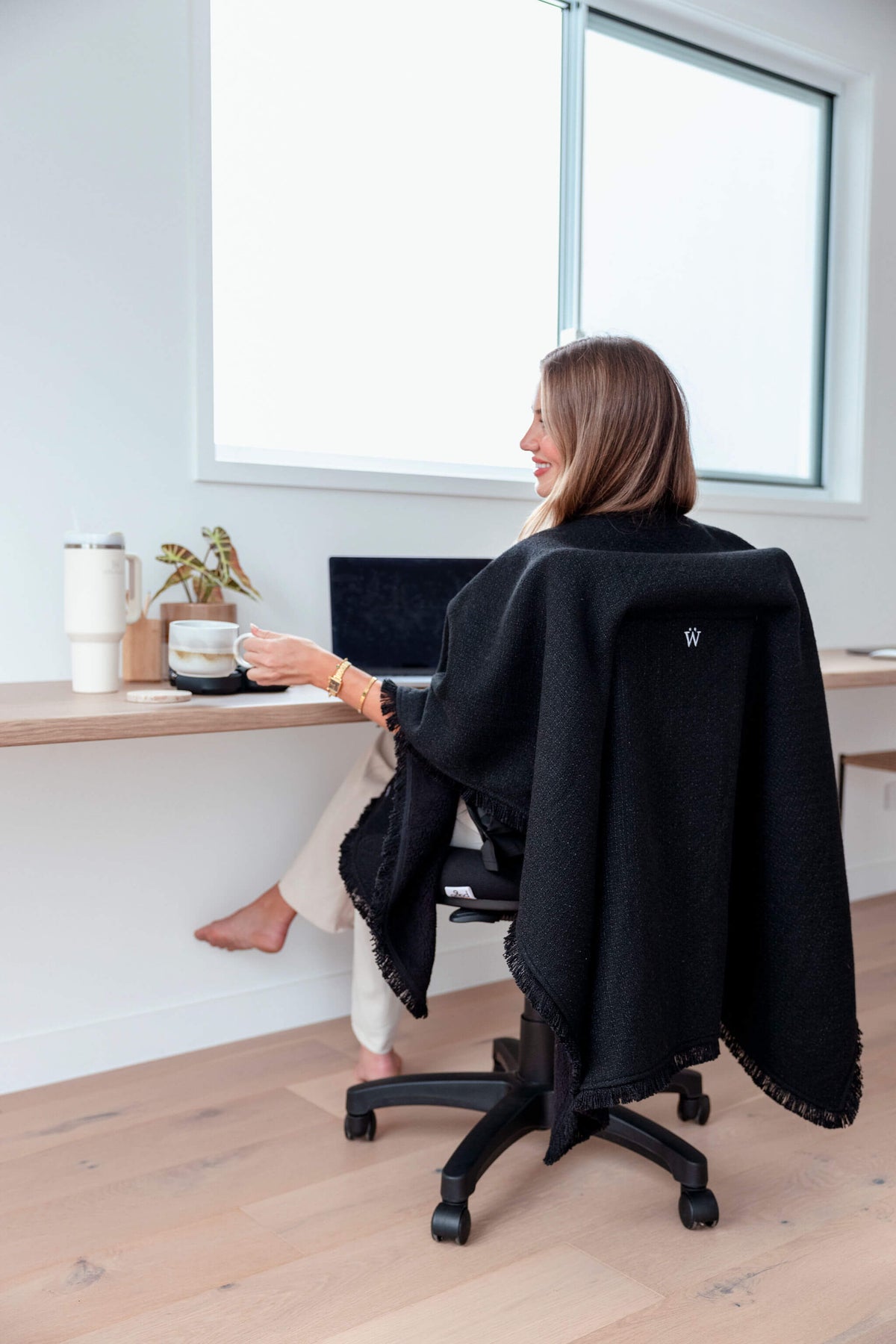 Elegant black office chair blanket designed for boardrooms, client meetings, and professional workspaces where warmth meets sophistication.